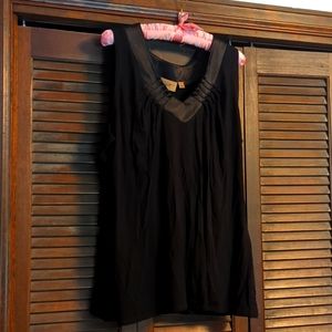 Sleeveless blouse with satiny neckline